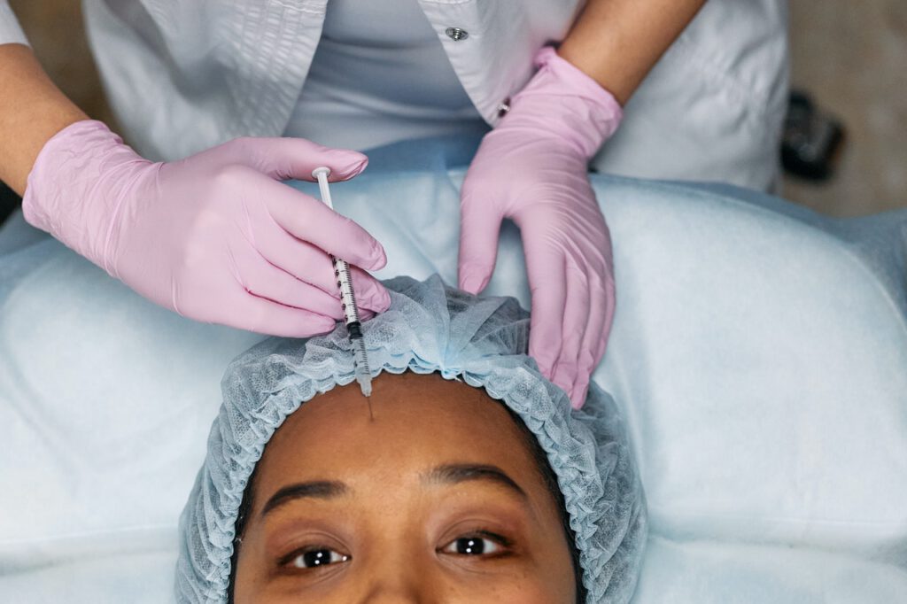 Botox procedure is done to a women by doctor