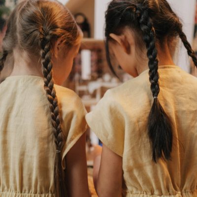 Two girls and both of them are having beautiful braids