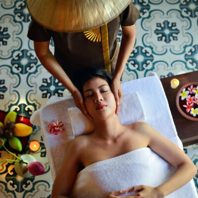 A woman is having a facial massage